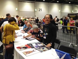 Chris Achilleos, at the Titan book signing, foreground, with artists Ian Miller, Jim Burns, John Harris seated behind him