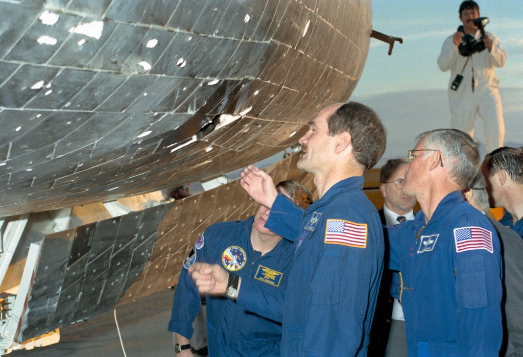Crew of STS-27 Examine Tile Damage on Atlantis