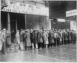 Unemployed men queued outside a depression soup kitchen opened in Chicago by Al Capone, 1931