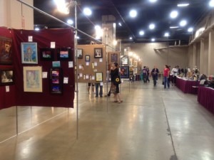 3-D art tables are typically set off to the side or behind the "main" art show panels for 2-D art, as here at the 71st Worldcon,  LoneStarCon3