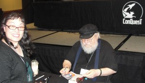 Roslynn Ernst having her Game of Thrones book signed by George R. R. Martin at the Conquest 46.  picture taken by Jason Ernst